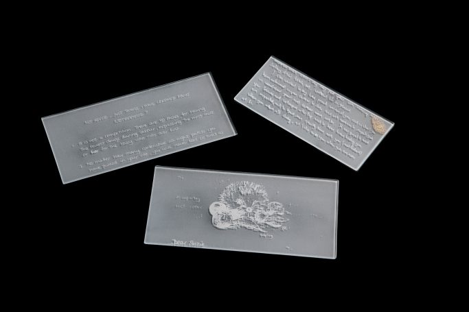 Screen printed letters with white enamel on sand blasted glass
